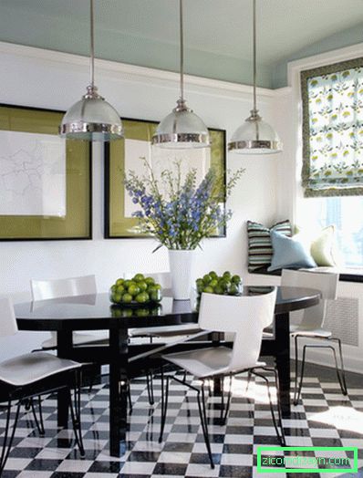Green accents on the black and white kitchen