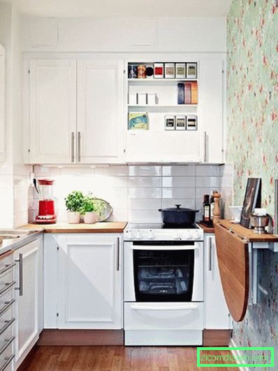 White apron from tiles in the interior of a small kitchen